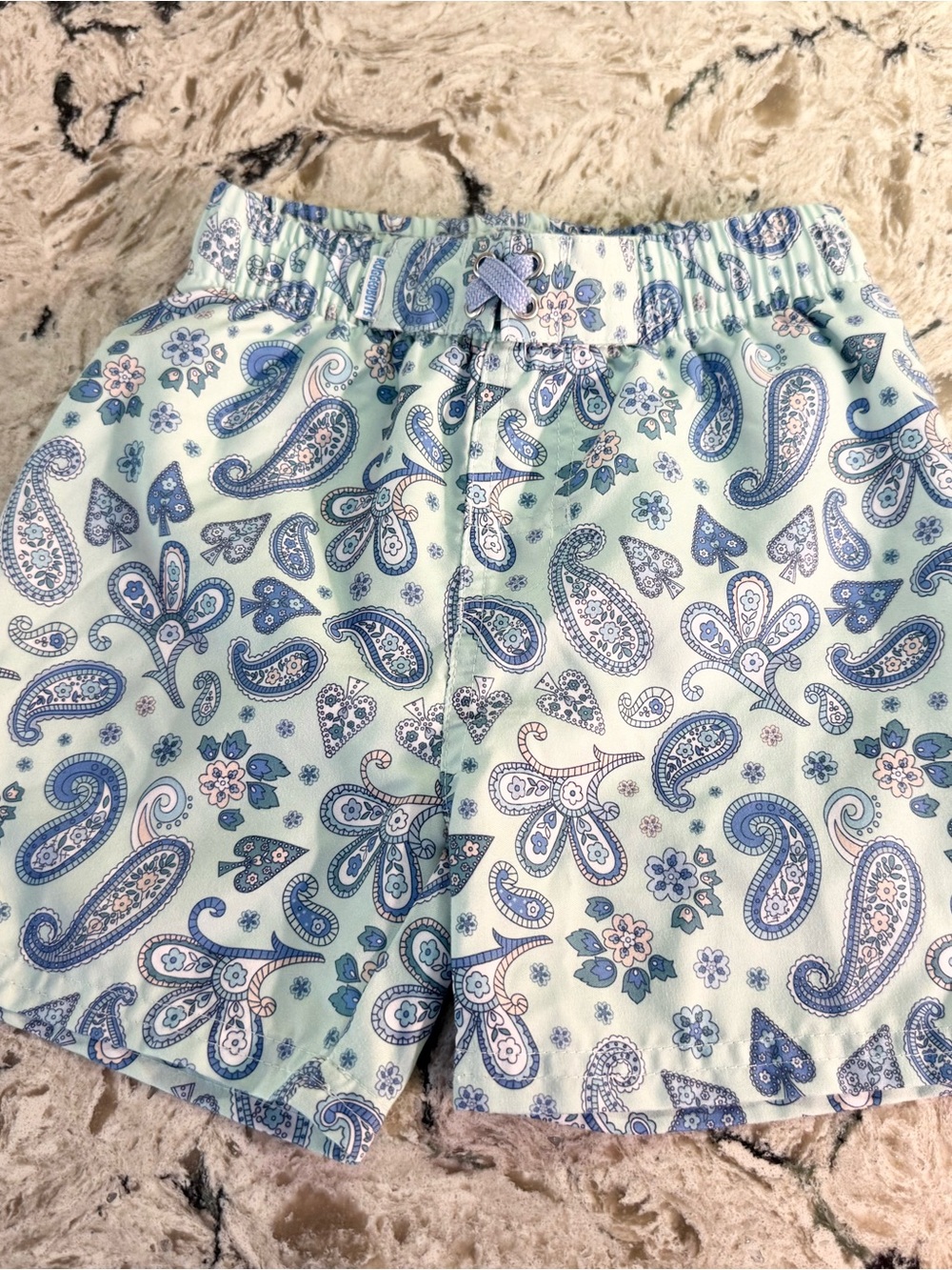 Ruffle Butts Light Blue Paisley Pull-On Swim Trunks